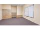 Unfinished basement with bare stud walls and concrete foundation with window at 203 Crescent Moon Way Way, Canton, GA 30114