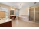 Spacious bathroom featuring a large tub, shower, vanity and many windows for great lighting at 203 Crescent Moon Way Way, Canton, GA 30114