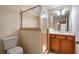 Tiled bathroom featuring glass shower, vanity, and toilet at 203 Crescent Moon Way Way, Canton, GA 30114
