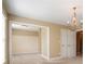 Bedroom featuring a view into another room with closing double doors at 203 Crescent Moon Way Way, Canton, GA 30114