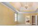 Bedroom featuring a tray ceiling and an open en suite bathroom at 203 Crescent Moon Way Way, Canton, GA 30114