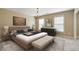 Modern bedroom with wood-frame bed, chandelier, and two bright windows at 203 Crescent Moon Way Way, Canton, GA 30114