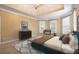 Inviting main bedroom with a tray ceiling, lots of natural light, and neutral decor at 203 Crescent Moon Way Way, Canton, GA 30114