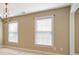 Bedroom featuring modern chandelier and well-lit windows with coverings at 203 Crescent Moon Way Way, Canton, GA 30114