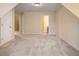 Spacious bonus room with neutral carpet and access to additional rooms at 203 Crescent Moon Way Way, Canton, GA 30114