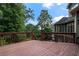 This outdoor deck has wood railings and offers views of a serene wooded setting at 203 Crescent Moon Way Way, Canton, GA 30114