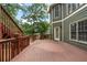 This outdoor deck features wood railings and is nestled in a serene wooded setting at 203 Crescent Moon Way Way, Canton, GA 30114