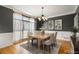 Dining room with hardwood floors, large windows and a modern chandelier at 203 Crescent Moon Way Way, Canton, GA 30114