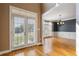 Foyer with hardwood floors and double French doors leading into the home at 203 Crescent Moon Way Way, Canton, GA 30114