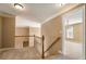 Upstairs hallway with carpet, railing and view into bedroom with chandelier at 203 Crescent Moon Way Way, Canton, GA 30114