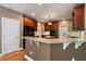 Well-equipped kitchen boasts granite countertops and modern appliances and fixtures at 203 Crescent Moon Way Way, Canton, GA 30114