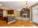 Open kitchen view of a breakfast nook with a fireplace and backyard access at 203 Crescent Moon Way Way, Canton, GA 30114