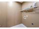 Efficient laundry room area with shelving units at 203 Crescent Moon Way Way, Canton, GA 30114