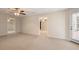 Open living area with neutral carpet, multiple entryways, and natural light at 203 Crescent Moon Way Way, Canton, GA 30114