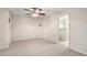 Large living area with ceiling fan, neutral carpet, and access to bathroom at 203 Crescent Moon Way Way, Canton, GA 30114
