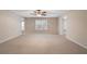 Large living room area with a ceiling fan and natural light from a window at 203 Crescent Moon Way Way, Canton, GA 30114