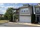 Charming two-story home featuring a balcony, two-car garage and neutral color palette at 301 Hayden Cir, Woodstock, GA 30189
