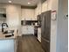 Modern kitchen with stainless steel appliances and ample cabinet space at 301 Hayden Cir, Woodstock, GA 30189