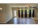 Bright living room features hardwood floors and backyard views at 301 Hayden Cir, Woodstock, GA 30189