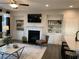 Cozy living room featuring a fireplace, built-in shelving and modern furnishings at 301 Hayden Cir, Woodstock, GA 30189