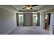 Large main bedroom with tray ceiling and lots of windows at 301 Hayden Cir, Woodstock, GA 30189