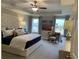 Serene main bedroom featuring a tray ceiling, plush bed and stylish decor at 301 Hayden Cir, Woodstock, GA 30189