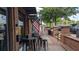 Charming restaurant featuring outdoor seating, an American flag, and inviting open sign at 301 Hayden Cir, Woodstock, GA 30189