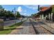 Scenic view of the historic train tracks with a building on the right and street on the left at 301 Hayden Cir, Woodstock, GA 30189