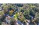 Real estate aerial view shows home bordered in yellow in a wooded neighborhood at 3081 Frankie Ln, Duluth, GA 30096