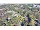 Property aerial view highlights house, carport, trees and residential setting at 3081 Frankie Ln, Duluth, GA 30096