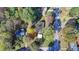 Overhead shot of a single Gathering home property in a suburban residential area, surrounded by greenery and streets at 3081 Frankie Ln, Duluth, GA 30096