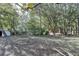 Expansive backyard with mature trees and privacy fencing, ready for outdoor enjoyment at 3081 Frankie Ln, Duluth, GA 30096