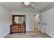 Bedroom featuring hardwood floors, a closet, and a wooden dresser with a mirror at 3081 Frankie Ln, Duluth, GA 30096
