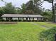 Charming single-story home with meticulously maintained landscaping and a well-manicured lawn at 3081 Frankie Ln, Duluth, GA 30096