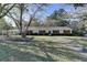 Charming one-story home featuring mature landscaping and a covered carport at 3081 Frankie Ln, Duluth, GA 30096