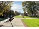 Picturesque park view includes grassy lawns, pedestrian walkways, and the town clock tower at 3081 Frankie Ln, Duluth, GA 30096