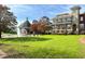 Scenic park view featuring lush green space, a fountain, a gazebo, and stately buildings at 3081 Frankie Ln, Duluth, GA 30096