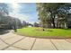 Beautiful park view features a manicured lawn, walkways, trees, and a distant clock tower at 3081 Frankie Ln, Duluth, GA 30096