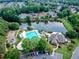 Aerial view showcasing community pool, clubhouse, and lake at 365 Morning Dew Cir, Roswell, GA 30075