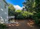 Exterior view of the home and deck with a landscaped backyard at 365 Morning Dew Cir, Roswell, GA 30075