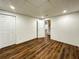 Basement room with wood floor and access to stairs at 365 Morning Dew Cir, Roswell, GA 30075