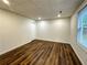 Basement room with wood flooring and a closet at 365 Morning Dew Cir, Roswell, GA 30075