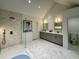 Bright bathroom with marble floors, a glass shower, and dual vanities at 365 Morning Dew Cir, Roswell, GA 30075