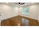 A minimalist bedroom with hardwood floors and a large window at 365 Morning Dew Cir, Roswell, GA 30075