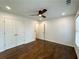 Bedroom featuring hardwood floors, double closets, and recessed lighting at 365 Morning Dew Cir, Roswell, GA 30075