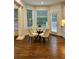 A charming breakfast nook is surrounded by windows, with views of the outdoors at 365 Morning Dew Cir, Roswell, GA 30075