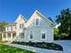 A beautiful craftsman home with manicured landscaping and a stone porch at 365 Morning Dew Cir, Roswell, GA 30075