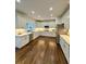 Modern kitchen with white cabinets, stainless steel appliances, and hardwood floors at 365 Morning Dew Cir, Roswell, GA 30075