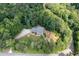 Secluded home surrounded by mature trees offering privacy and a peaceful setting at 3990 Wesley Chapel Rd, Marietta, GA 30062