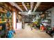 Unfinished basement with exposed ductwork, a workbench, and storage shelving, perfect for a workshop at 3990 Wesley Chapel Rd, Marietta, GA 30062